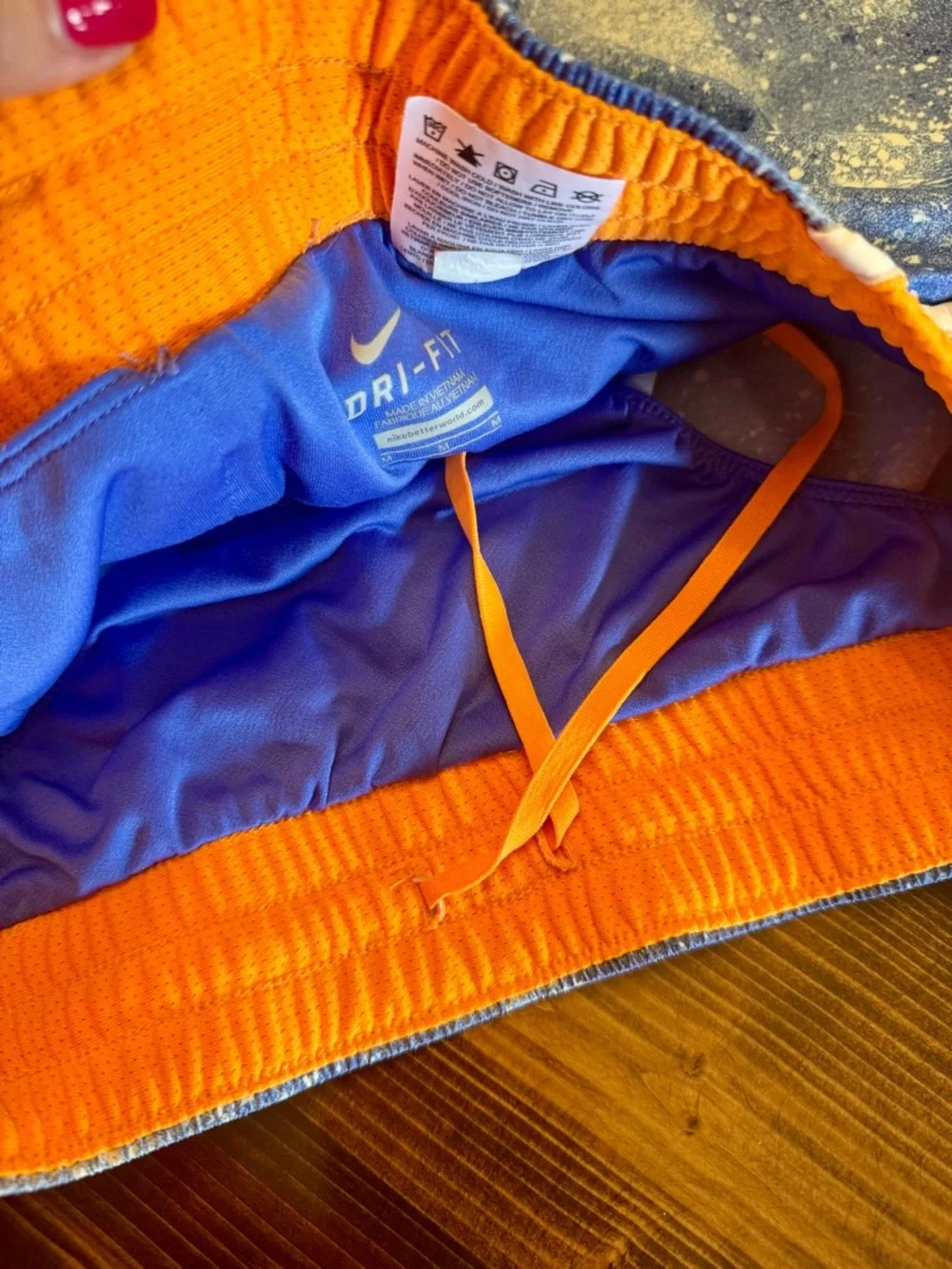 Nike Dri Fit Women’s Blue Splatter Running Shorts with Orange Side Panels M‎